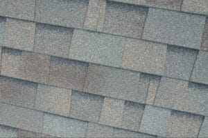 A close up image of asphalt shingles installed on a Colorado home by Roof Source.